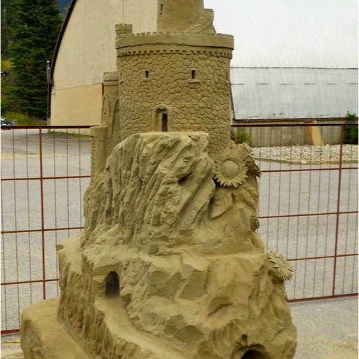 Sand sculpture of the front of a castle. 