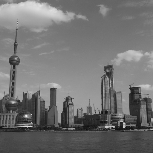 Black and white photograph of the Pudong District, taken from the other side of the Huangpu River in Shanghai. 